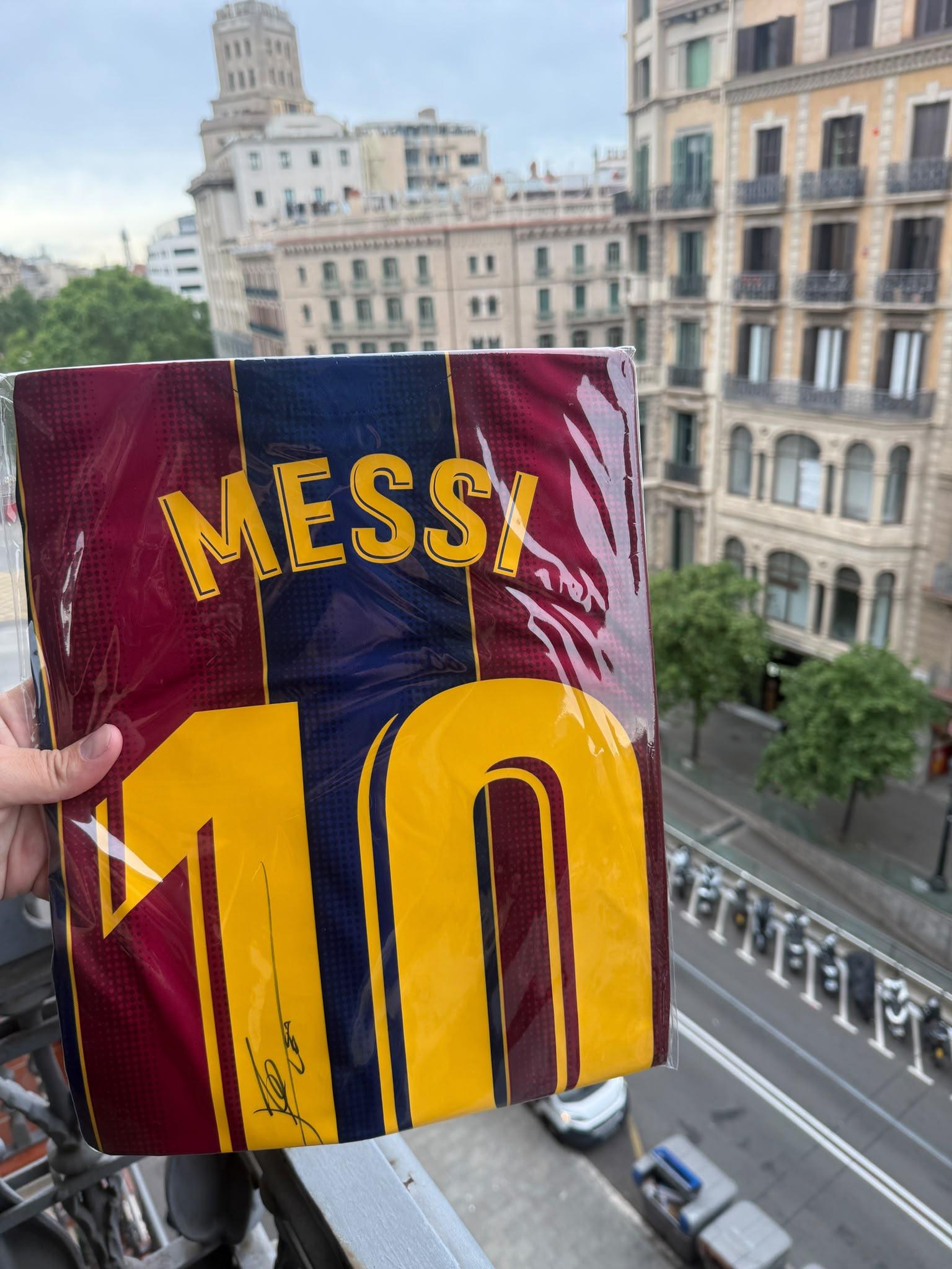 Reverse of the shirt showing the Messi autograph